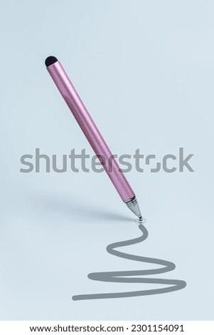 Pink stylus for tablet on blue background. Vertical. Stylus for drawing on the touch screen Foto stock © 