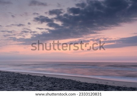 Pink sunrise at Assateague Beach in Virginia.