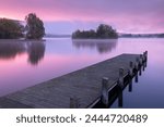 Pink sunrise over Llangorse Lake in the Brecon Beacons National Park, Powys, Wales, United Kingdom, Europe