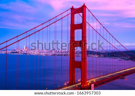 pink sunset cloudscape amazing Golden gate bridge the national landmark of America and West Coast national treasure suspension bridge of San Francisco California