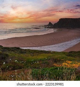 Pink Sunset Ocean Scenery And Summer Odeceixe Beach (Aljezur, Algarve, Portugal).