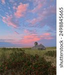 Pink sunset at Old Harbor Life Saving Station at Race Point in Cape Cod