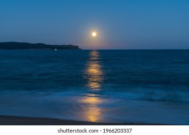 The Pink Supermoon, Full Moon Over The Sea At Pearl Beach On The Central Coast, NSW, Australia.