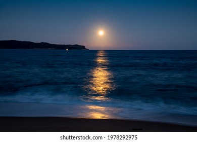 The Pink Supermoon, Full Moon Over The Sea At Pearl Beach On The Central Coast, NSW, Australia.