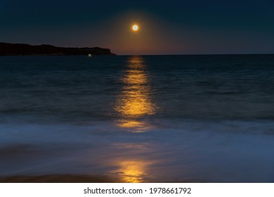 The Pink Supermoon, Full Moon Over The Sea At Pearl Beach On The Central Coast, NSW, Australia.