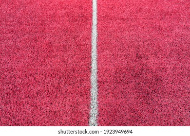 Pink synthetic grass sports field with white line shot from above. Soccer, rugby, football, baseball sport concept - Powered by Shutterstock