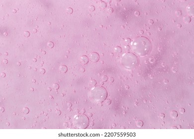 Pink Textured Gel Background With Bubbles Close Up. The Concept Of Cosmetic, Medical And Other Laboratory Research. Selective Focus