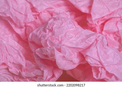 Pink Tissue Paper Or Silk Paper Close-up, Creased And Wrinkled Sustainable Packaging Material Detail, Selective Focus