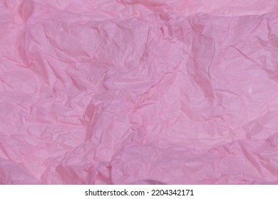 Pink Tissue Paper Or Silk Paper Close-up, Slightly Creased And Wrinkled Sustainable Packaging Material Detail