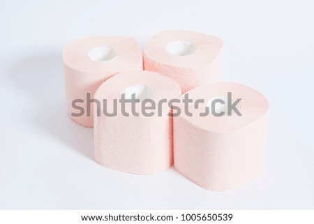 Pink toilet paper on a white background