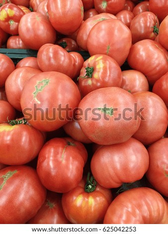Pink tomato harvest. Tomato background. many pink  tomatoes. 