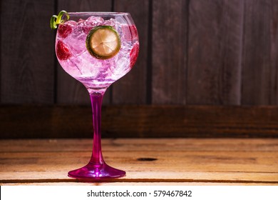 Pink Tonic Gin With Raspberries, Wooden Background