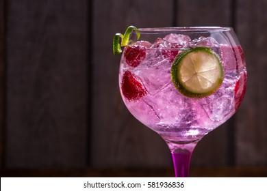 Pink Tonic Gin With Raspberries, Wooden Background