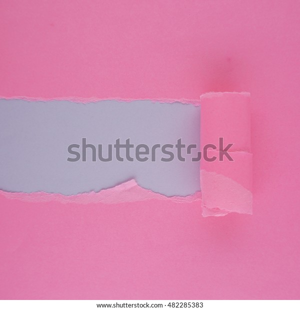 Pink torn paper with space for text. Pink torn\
paper on light purple\
paper