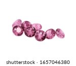 Pink tourmaline diamond cut gems on a white background.