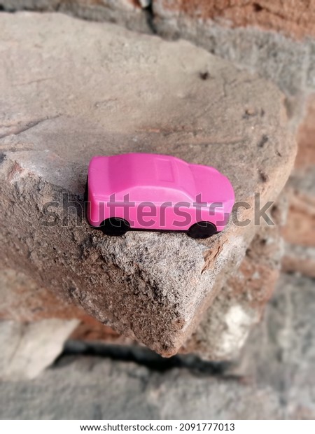 pink toy car kept\
in bricks December 2021.