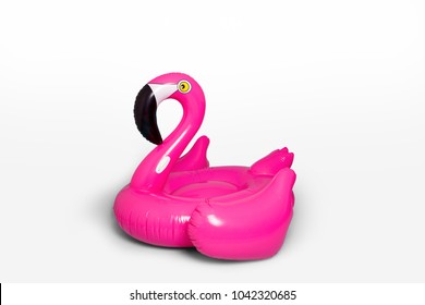 Pink, trendy, blown beach flamingo isolated on white background. Hit the summer. Pink flamingo. Pink flamingo, tropical bird shape inflatable for swimming pool. - Shutterstock ID 1042320685
