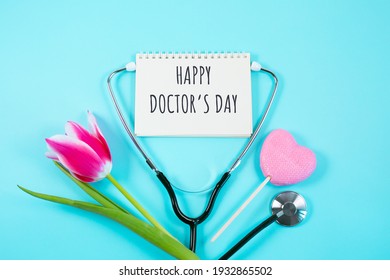 Pink Tulip, Candy And Stethoscope On Blue Background. Happy Nurse Day. National Doctors Day. Womens Health. Flat Lay Top View,