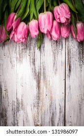 Pink tulips over shabby