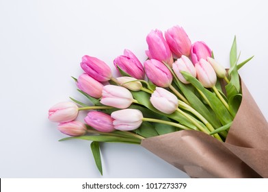 flowers wrapped in brown paper