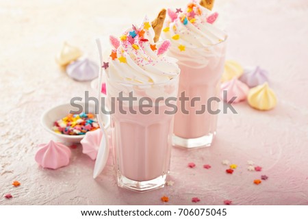 Pink unicorn milkshakes with whipped cream, sugar and sprinkles