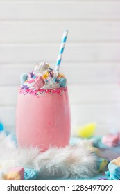 Pink Unicorn Strawberry Milkshake With  Whipped Cream, Sugar And Colorful Confetti