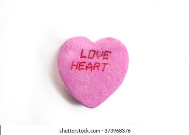 Pink Valentine's Day Candy Heart With Love Heart Text Word On White Background