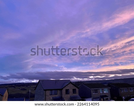 Pink and violet sky over the rooftops of the Holme balley