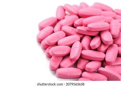 Pink Vitamin Pills For Women On A White Background. Multivitamins For Women's Health, Isolate, Free Space