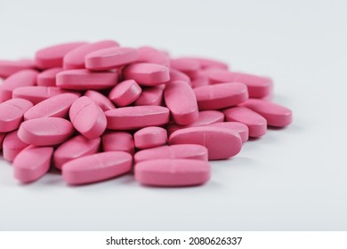 Pink Vitamin Pills For Women On A White Background. Multivitamins For Women's Health, Isolate, Free Space