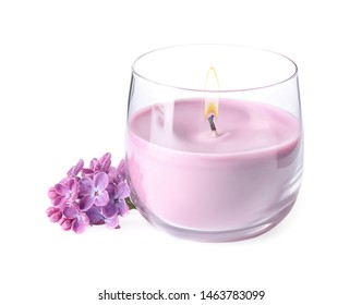 Pink Wax Candle In Glass Holder And Lilac Flowers Isolated On White