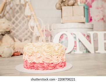 Pink And White Decoration For A 1st Birthday Cake Smash Studio Photo Shoot With Balloons, Paper Decor, Cake And Topper. High Quality Photo