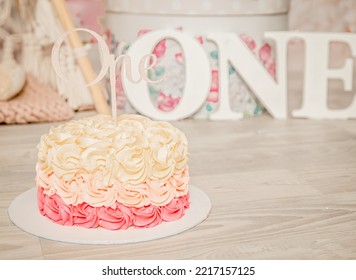 Pink And White Decoration For A 1st Birthday Cake Smash Studio Photo Shoot With Balloons, Paper Decor, Cake And Topper. High Quality Photo