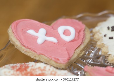 Pink And White Frosted Heart Valentine Cookie With The Letters XO For The Meaning Of Hugs And Kisses
