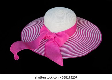 Pink and white stripe big floppy hat - isolated with black background - center focus