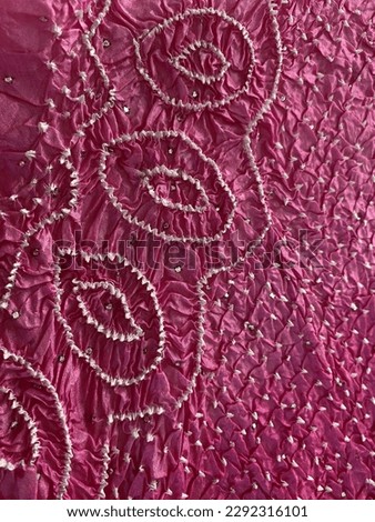 Pink and white tie dye bandhini traditional textile of India 