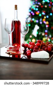 Pink Wine Bottle, Two Wineglasses, Grape, Slices Of Bacon And Cheese On Christmas Background