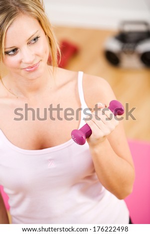 Pink: Woman Working Out With Small Weights