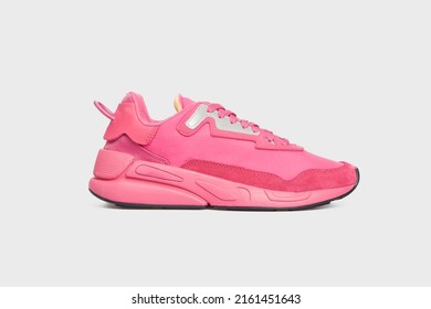 Pink women's basketball sneaker with high sole. Female sports shoe, boot isolated on white background. Footwear, casual leather training shoe. Template, mock up