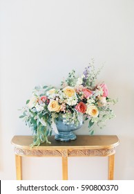 Pink And Yellow Flower Arrangement On A Gold Table