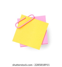 Pink and yellow sticky notes with paper clip on white background