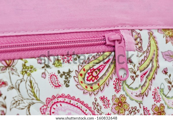  pink zip on a bag\
background