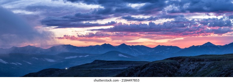 Pinks and purples in the clouds at sunset over the Never Summer Mountains as seen from Trail Ridge Road in Rocky Mountain National Park, Colorado - Powered by Shutterstock