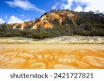 The Pinnacles are coloured sands cliffs located along the 75 mile beach on the east coast of Fraser Island, Queensland, Australia - They have been stained over thousands of years with clay