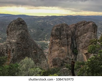 Pinnacles National Park, California. Sunset view from the top of High Peaks & Balconies Cave Loop Trail. View has volcanic mountains, unique rock formations, green trees and cliffs.