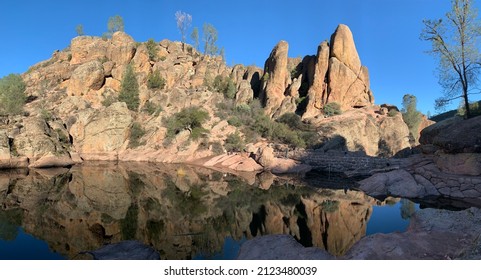 Pinnacles National Park Monterey California or National Monument Red rocks over looking a reservoir with beautiful perfect seamless reflections great place to get out and go for a hike and adventure - Shutterstock ID 2123480039