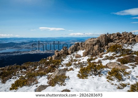 The pinnacles rock formation on the summit of Mount Wellington with the view of Hobart the capital and most populous city of the Australian island state of Tasmania.
