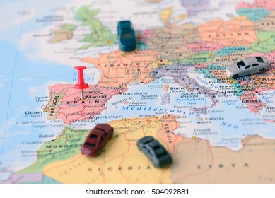 Pinned on map of Madrid in Spain and miniature car.