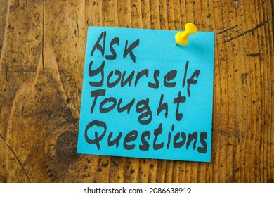 Pinned Sticker With An Inscription Ask Yourself Tough Questions.