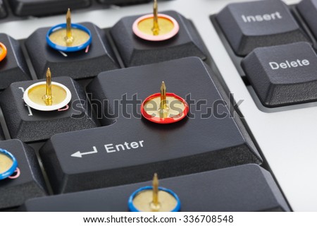 Pins on computer keyboard - concept background
